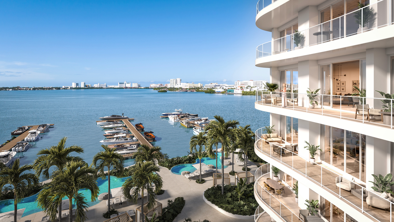 Private 42-slip marina with turquoise lagoon and curved balconies